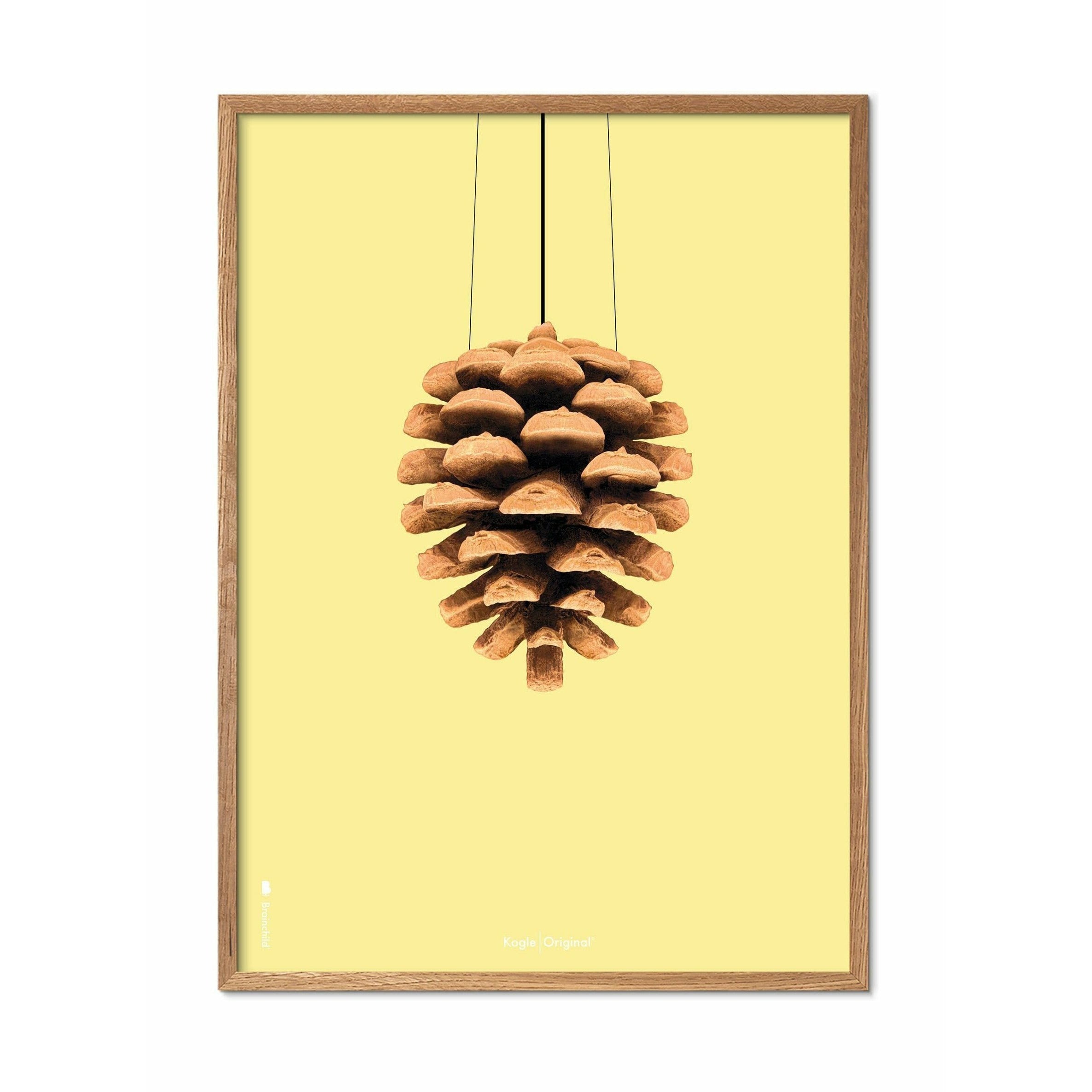 Brainchild Pine Cone Classic Poster, Frame Made Of Light Wood 50x70 Cm, Yellow Background